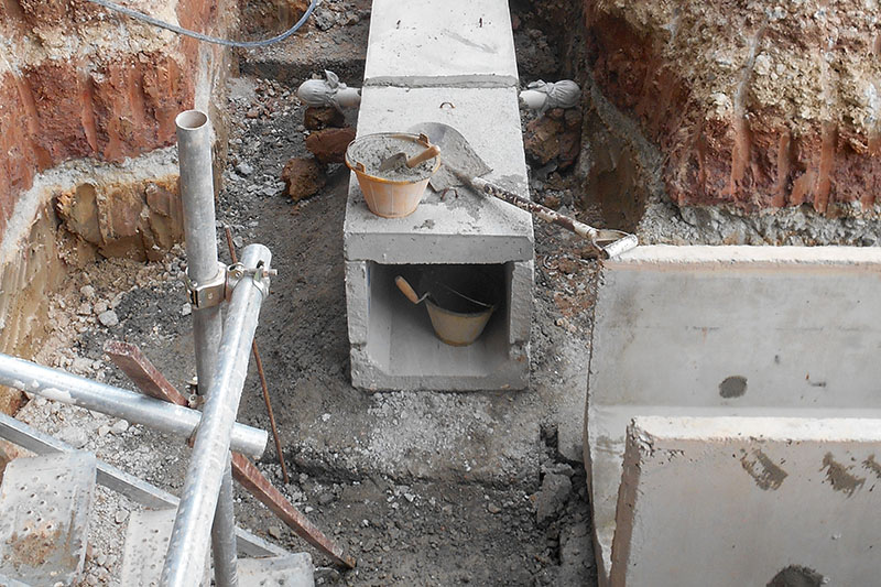 Precast concrete box culvert drain lay at the construction site.